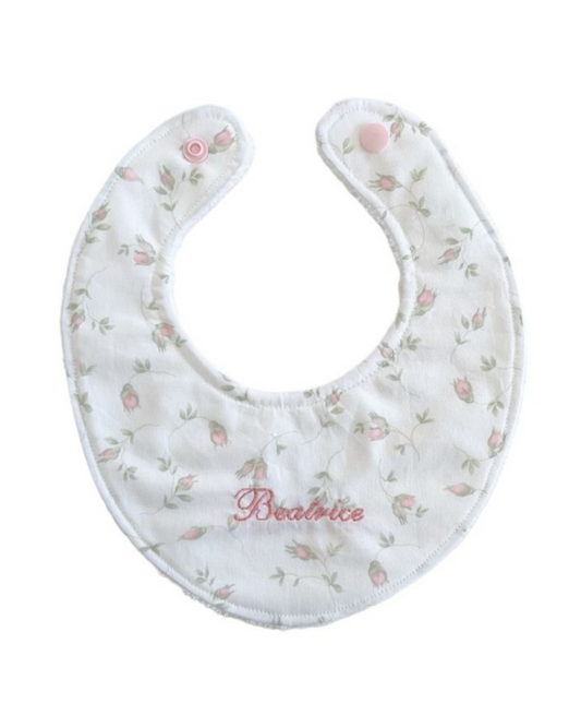 Bavaglino con bottone a fantasia con ricamo